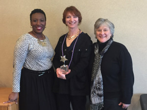2015 Liberty Resources Values in Practice (VIP) award recipient Michelle Walker (center) with Vice President of Family Services Kortney Dale and Family Services Director Donna Carini.